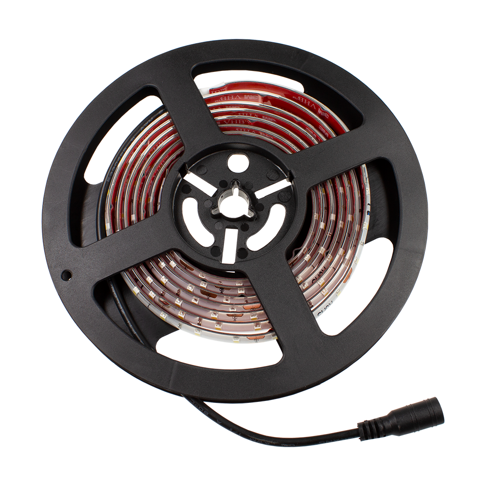 Target-Corona-Ersatzteil-LED-Band-1 Das Bild zeigt eine Rolle mit einem LED-Band als Ersatzteil für das Produkt "Target CORONA Vision". Das LED-Band ist auf einer schwarzen Spule aufgewickelt und hat einen Anschlussstecker.