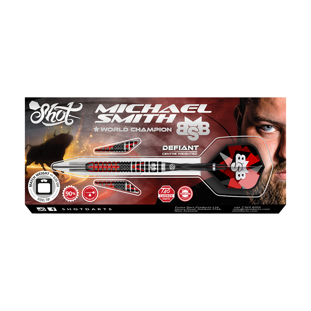 Shot Michael Smith Defiant Steeldarts Das Bild zeigt die Verpackung der "Shot Michael Smith Defiant Steeldarts". Auf der Schachtel ist ein Dartpfeil zusammen mit dem Bild eines Mannes und verschiedenen Informationen zum Produkt abgebildet.