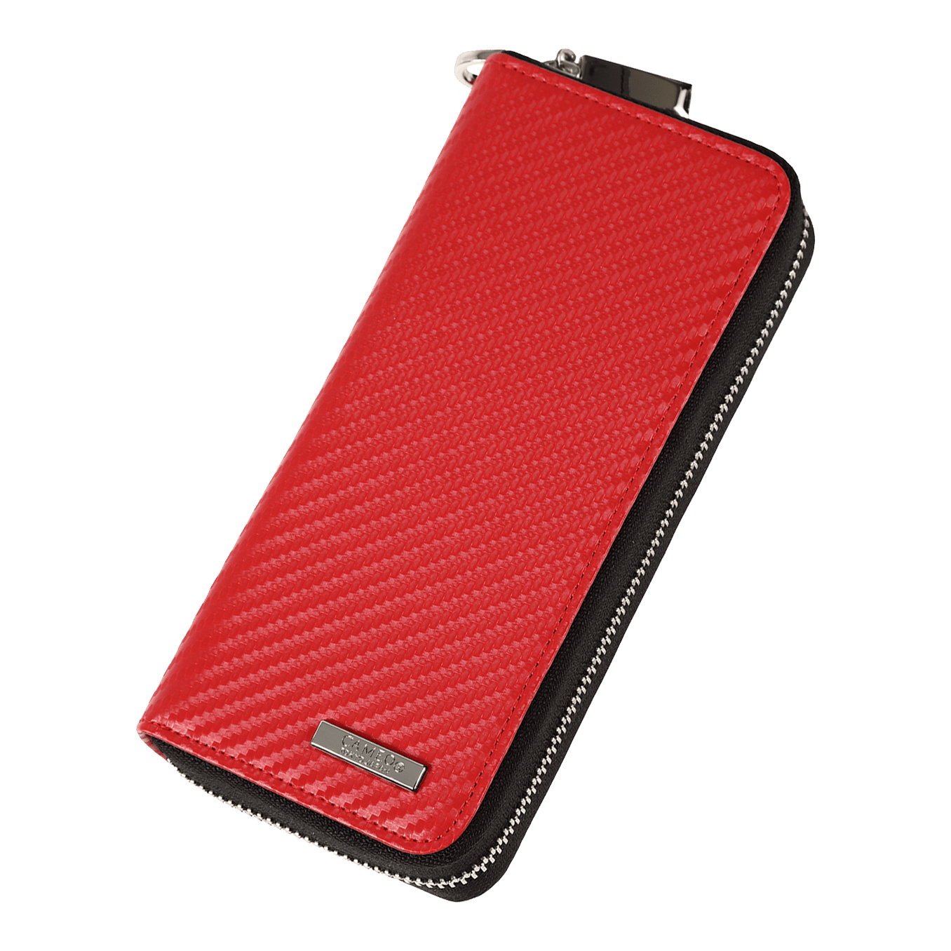 Cameo Business Case Pro3 Das Bild zeigt ein rotes Etui mit einer strukturierten Oberfläche und einem Reißverschluss. An der unteren Ecke befindet sich ein kleines Metallschild mit einer Gravur.