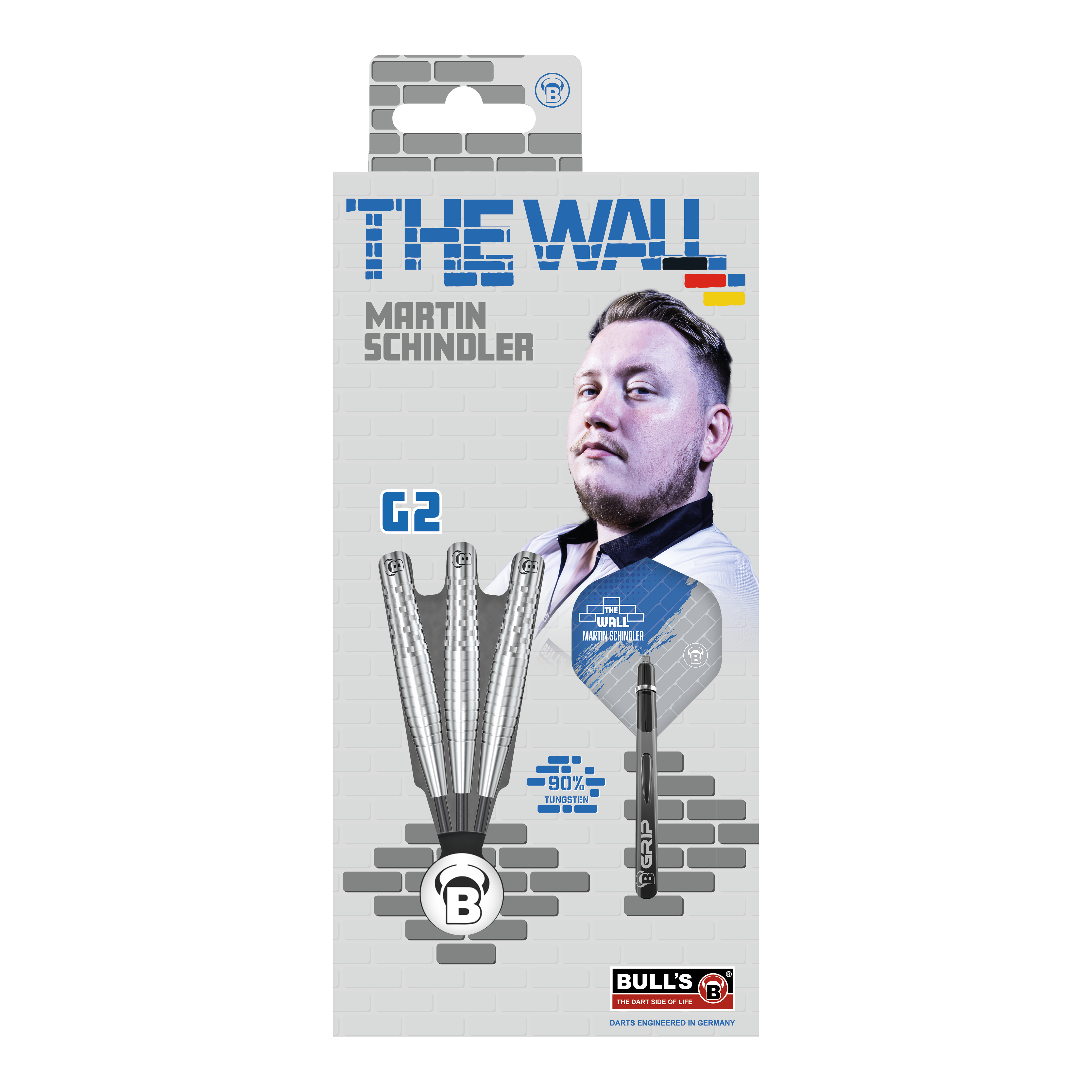 Die Verpackung zeigt die "Bulls Martin Schindler Original Generation 2 Steeldarts" mit dem Bild von Martin Schindler. Auf der Vorderseite sind drei Darts und die Aufschrift "THE WALL" sowie "90% Tungsten" abgebildet.