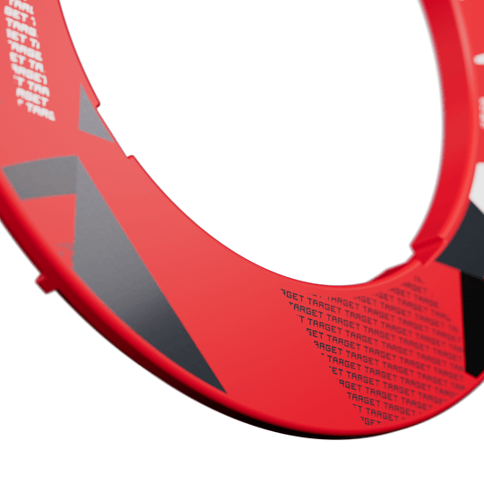 Target Notched Patterned Dartboard Surround Eine Nahaufnahme eines roten Dartboard-Surrounds ist abgebildet. Das Surround hat ein gemustertes Design.
