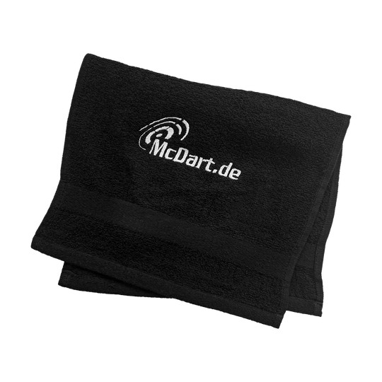 38cLhAIysMtRQB Das Bild zeigt ein schwarzes Schweißtuch mit dem Aufdruck "McDart.de". Das Tuch ist ordentlich gefaltet und wirkt weich und hochwertig.