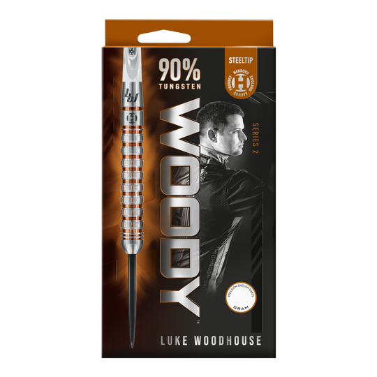 Das Bild zeigt die Verpackung der Harrows Luke Woodhouse Series 2 Steeldarts. Auf der Vorderseite sind ein Dartpfeil, der Name "WOODY" und ein Bild von Luke Woodhouse zu sehen.